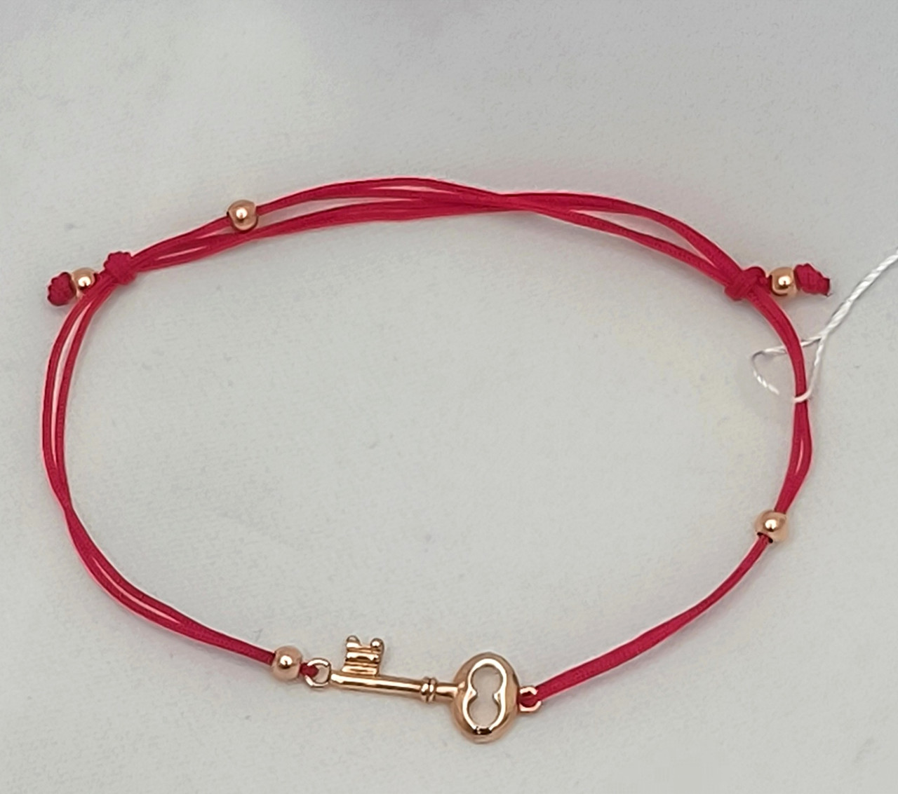 Текстильна нитка на руку зі вставками золота 585 проби