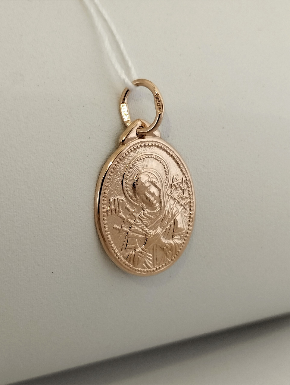 Золотий кулон